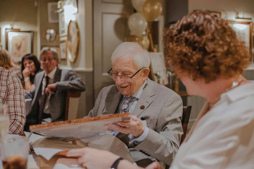 Caregiver holding an older man's hands