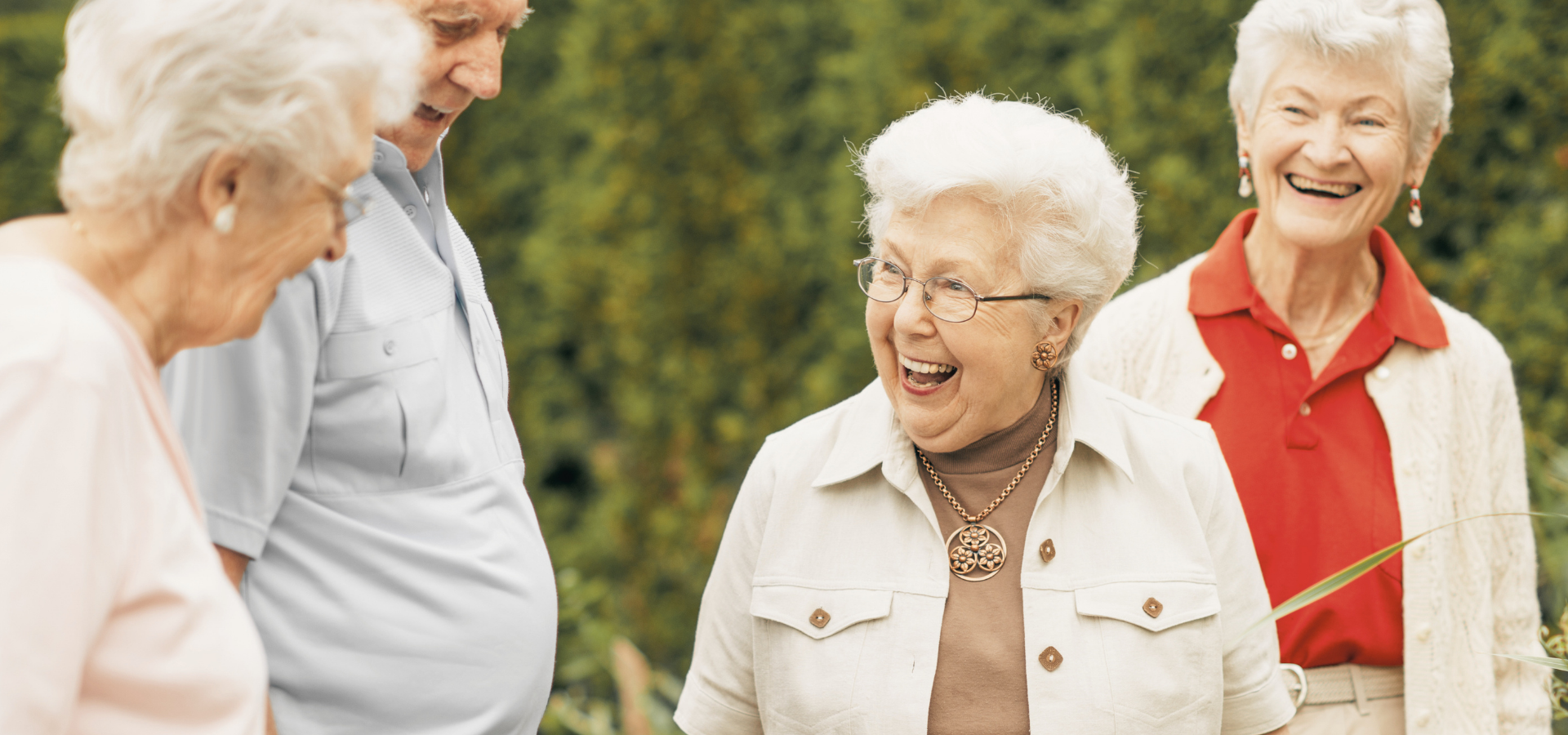 Senior women laughing together outdoors